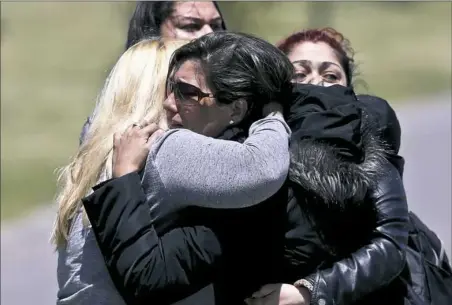  ?? Esteban Felix/Associated Press ?? Relatives of missing submarine crew member Celso Oscar Vallejo react to the news that a sound detected during the search for the ARA San Juan submarine is consistent with that of an explosion Thursday at the Mar de Plata Naval Base in Argentina.