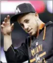  ?? WILFREDO LEE — THE ASSOCIATED PRESS FILE ?? Miami Marlins pitcher Jose Fernandez replaces his cap Sept. 19 after the singing of the national anthem before the start of a baseball game between the Miami Marlins and the Chicago Cubs, in Miami.