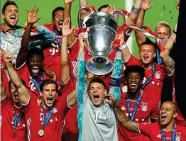  ??  ?? Setting the standard: Bayern lift the Champions League in August