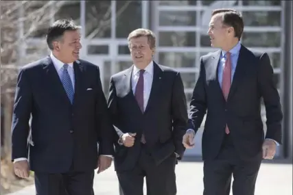  ?? CHRIS YOUNG, THE CANADIAN PRESS ?? Ontario Finance Minister Charles Sousa, left, Toronto Mayor John Tory and Federal Finance Minister Bill Morneau arrive for housing market talks Tuesday.