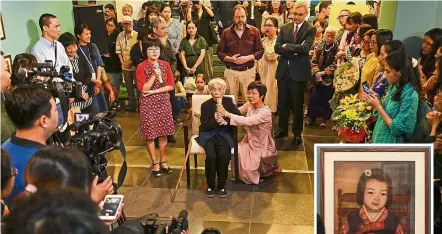  ??  ?? Finally recognised: Bich addressing guests during the opening of her first solo exhibition at the French Cultural Centre in Hanoi. (Inset) A silk painting of a girl by Bich.