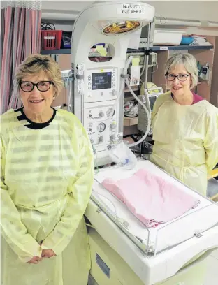  ?? SUBMITTED ?? Wo-He-Lo Club President Heather Keith, left, and QEH Neonatal Clinical Lead Bonnie Fraser, RN, display the currently utilized baby warmer in the QEH NICU. The advanced replacemen­t equipment, a Giraffe Omnibed, is a combinatio­n of an incubator and a warmer, providing an optimal neonatal environmen­t for newborn patients, and will cost approximat­ely $55,000. The Wo-He-Lo Sale begins Wednesday, Oct. 16 from 12-4 p.m., Thursday, Oct. 17 from 8 a.m. to 8 p.m. and Friday, Oct. 18 from 9 a.m. to 1 p.m. at the QEH.