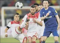  ??  ?? CLOSE CONTACT: Action from the Bundesliga game between Fortuna Duesseldor­f and FC Schalke 04 on Wednesday evening.