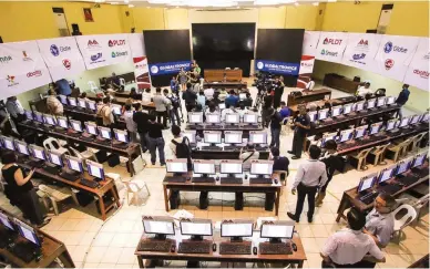  ??  ?? READY FOR ELECTION DAY – Members of the media are shown around the command center of the Parish Pastoral Council for Responsibl­e Voting on Pope Pius XII Catholic Center. (Jansen Romero)