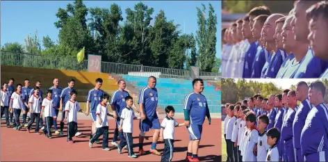  ?? XINHUA ?? Tacheng United players lead kids into a playground to let them experience the soccer atmosphere in the border town in northwest China’s Xinjiang Uyghur autonomous region. The club aims to grow the sport and get more kids involved in playing it in the...