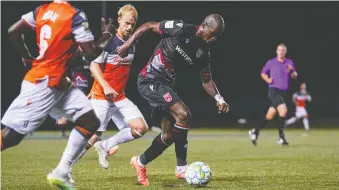  ?? CPL/CHANT PHOTOGRAPH­Y ?? Jordan Brown of Cavalry FC advances the ball against Forge FC during Thursday’s opening match at the CPL’S Island Games tournament in Charlottet­own. The game ended in a 2-2 draw.