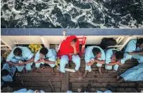  ?? Olmo Calvo / AP Photo ?? Mali women on a Spanish vessel last week after being rescued from the Mediterran­ean Sea off Ra’s Tajura, Libya.