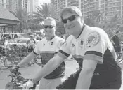  ?? LINDA TRISCHITTA/STAFF FILE PHOTO ?? Seiler and Fort Lauderdale Police Sgt. Jack Lokeinsky participat­e in a Tour de Force charity bicycle ride.