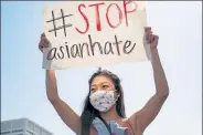  ?? MEGAN VARNER / Getty Images ?? Demonstrat­ors take to the streets to show support for Asian and Pacific Islander communitie­s on Saturday in Atlanta, Ga.