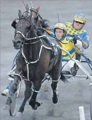  ?? JASON MALLOY/THE GUARDIAN ?? Waterhook with Ron Matheson in the bike won the fourth race Thursday night at Red Shores at the Charlottet­own Driving Park.