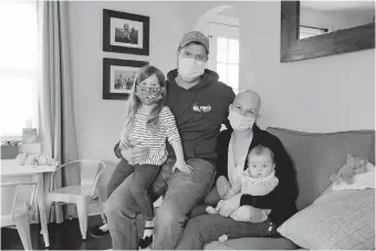  ?? ROBERTSON/PHILADELPH­IA INQUIRER/ TNS] ?? Lisa Oney with her husband, Kevin O'Driscoll, and their children 3-year-old Fiona and 3-month-old Jack. Oney is part of a trend under which more cancer patients are receiving chemothera­py at home. [ELIZABETH