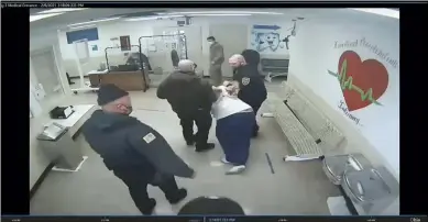  ?? OHIO DEPARTMENT OF REHABILITA­TION AND CORRECTION VIA AP ?? In this image made from video, prison guards escort Michael McDaniel, 55, to the medical facility at the Correction­al Reception Center in Orient. Ohio’s correction­al agency has terminated seven employees after officials say prison guards used excessive and unjustifie­d force against a Black inmate before he died in custody in February. The Ohio Department of Rehabilita­tion & Correction sent a notice of removal to five correction­s officers, a supervisor and a licensed nurse following an investigat­ion into the in-custody death of 55-year-old Michael McDaniel.