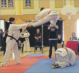  ?? SUBMITTED PHOTO ?? Dahlen Doubleday breaking boards with a Split Kick.