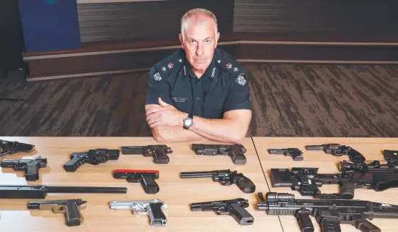  ?? ?? Superinten­dent of Licensing and Registrati­on, Dan Trimble with a range of gel blaster guns. Picture: David Crosling