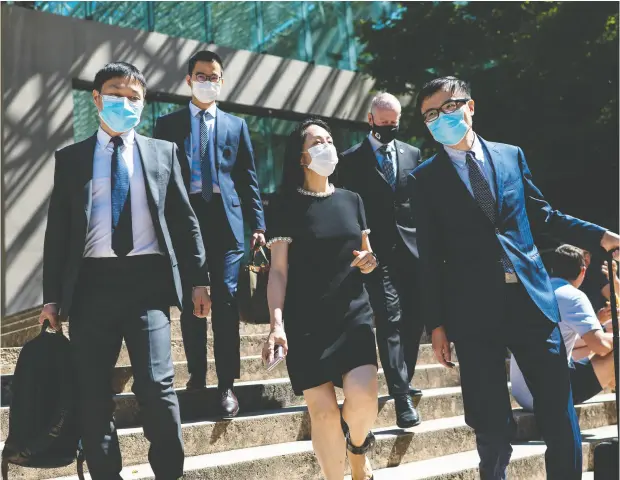  ?? JIMMY JEONG / THE CANADIAN PRESS ?? Meng Wanzhou, chief financial officer of Huawei, leaves for a lunch break during her extraditio­n hearing at B.C. Supreme Court on Thursday.