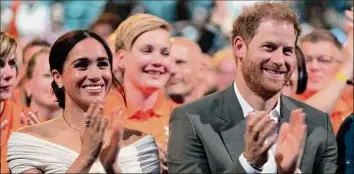  ?? Peter Dejong / Associated Press ?? Prince Harry and Meghan Markle, duke and duchess of Sussex, attend the opening ceremony of the Invictus Games on Saturday in The Hague, Netherland­s.