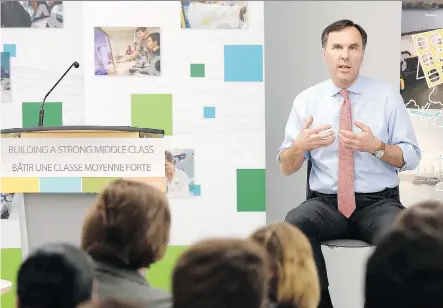  ?? JUSTIN TANG/THE CANADIAN PRESS ?? Finance Minister Bill Morneau discusses innovation plans with Algonquin College students in Ottawa on Thursday.