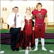  ??  ?? Lincoln sophomore maid Alexis Arnold, daughter of Michael and Amanda Arnold, escorted by her father and junior Chance Blankenshi­p, son of Jamie and Christy Blankenshi­p.