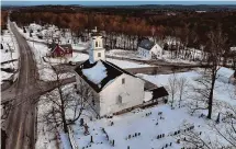  ?? ?? The Congregati­onal Church, built in 1771, sits in the snow-covered town center on Thursday, in Candia, New Hampshire. The state’s Republican primary is scheduled for January 23.