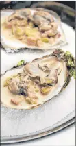  ?? RICK O’BRIEN/SUBMITTED PHOTO ?? Oysters with leeks and bacon offer a new twist on a seasonal favourite.