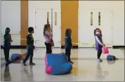  ?? DAI SUGANO — STAFF ARCHIVES ?? First-graders maintain social distance before heading to the playground during a recess at Foothill Elementary School in Saratoga on Feb. 10. Stanford University will participat­e in a pediatric trial of a Pfizer COVID-19 vaccine for children this spring.