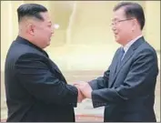  ?? South Korean Presidenti­al Office ?? KIM JONG UN, left, with South Korean national security director Chung Eui-yong, apparently made his offer in a bid to facilitate North Korea-U.S. talks.