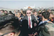  ?? — Reuters ?? Afghan Vice-president Abdul Rashid Dostum arrives at the Hamid Karzai Internatio­nal Airport in Kabul on Sunday.