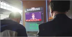  ?? JUNG YEON-JE/AFP ?? People watch a news report showing South Korean President Park Geun-hye making a public apology on Tuesday.