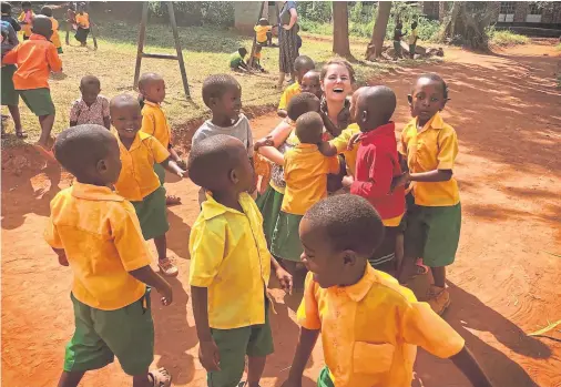  ??  ?? TEACHER’S PETS: Caitlin Morrison’s time teaching in Rwanda through Global Learning Partnershi­ps was “so worth it”, she says