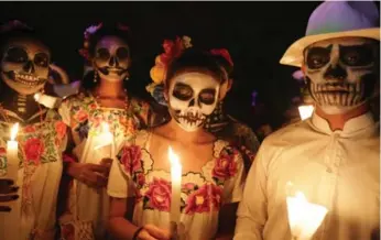  ?? ALEJANDRO MEDINA/AFP/GETTY IMAGES ?? Residents participat­e in El Paseo de Las Almas, The Walk of Souls, during a Day of the Dead festival.