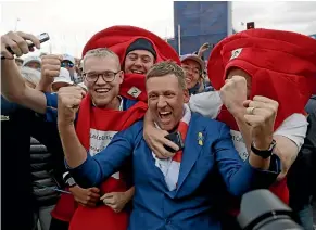  ?? AP ?? England’s Ian Poulter celebrates with fans after helping Europe win back the Ryder Cup.