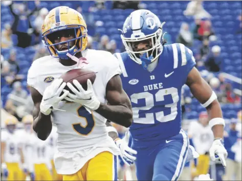  ?? CHRIS SEWARD AP PHOTO/ ?? Pittsburgh wide receiver Jordan Addison (3) hauls in a pass for a touchdown against Duke safety Lummie Young IV (23) during the first half of an NCAA college football game Nov. 6, 2021, in Durham, N.C.