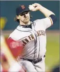  ?? Elsa Garrison Getty Images ?? BARRY ZITO pitched 7 2⁄3 innings of shutout ball, giving up six hits, walking one and striking out six.