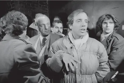  ?? ROBERT KARP/AP ?? In this Dec. 14, 1978, file photo, Studio 54 owner Steve Rubell, foreground, appears with his attorney Roy Cohn, second left, as he talks to reporters outside the club in New York following a drug and tax evasion raid. Cohn is the subject of the HBO documentar­y “Bully. Coward. Victim. The Story of Roy Cohn.”