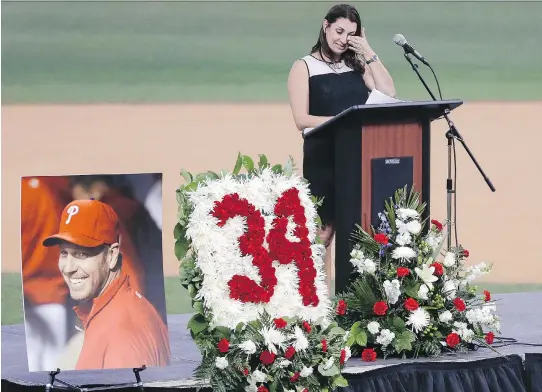  ?? YONG KIM/THE ASSOCIATED PRESS ?? Brandy Halladay, Roy Halladay’s widow, talks about her husband during a memorial tribute on Tuesday in Clearwater, Fla.