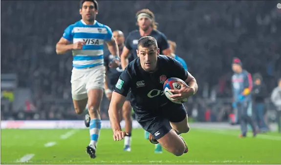  ??  ?? MAY DAY: England’s Jonny May throws himself over the line to touch down against Argentina at Twickenham.