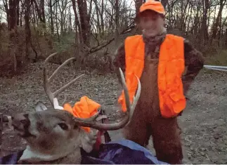  ?? DALE BOWMAN/SUN TIMES (ABOVE), DALE HORTON/PROVIDED ?? ABOVE: Garrett Glennon stands with his big 10-point buck, which he got on opening day of Illinois’ firearm season Friday at Des Plaines State Fish and Wildlife Area. BELOW: Erin Henne, 16, with her ninepoint buck in Edwards County.