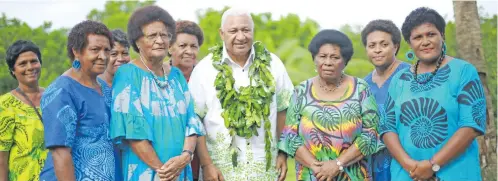  ?? Photo: Kelera Sovasiga ?? Prime Minister Voreqe Bainimaram­a with women of Namata Village.