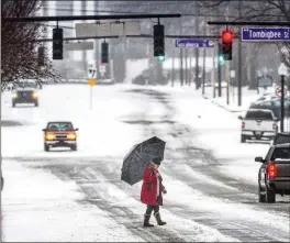  ?? DAN BUSEY/THE TIMES/DAILY VIA AP ?? Snow and temperatur­es around zero hit the Florence, Alabama, area last week, and bitterly cold conditions persisted through this weekend.