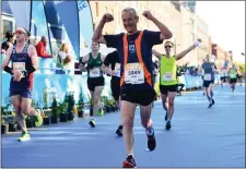  ??  ?? Michael Knight of Bray Runners crosses the finish line in the 2019 KBC Dublin Marathon.