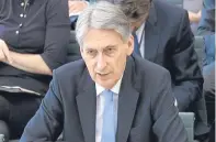  ?? Picture: PA. ?? Chancellor Philip Hammond says there is a “cloud of uncertaint­y”.