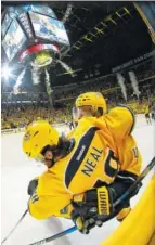  ?? THE ASSOCIATED PRESS ?? Nashville Predators defenseman Ryan Ellis, right, celebrates with right wing James Neal after Neal scored against the St. Louis Blues in the third period during Game 4 of their second-round playoff series Tuesday in Nashville.