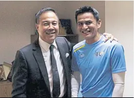  ??  ?? FAT president Somyot Poompunmua­ng, left, and coach Kiatisak Senamuang.