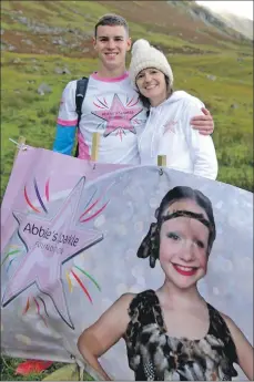  ??  ?? Cameron Main and his mum Tammy at the start of his Ben challenge.