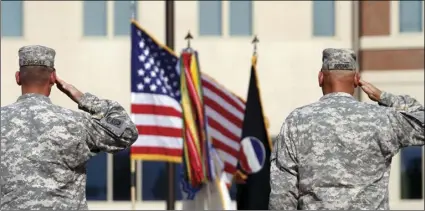  ??  ?? In this Sept. 12, 2011, file photo, generals salute during an installati­on ceremony at the U.S Army Forces Command at Fort Bragg, N.C., one the Army’s three major command headquarte­rs. The Army is scouting large cities in 2018 to find a home for a...