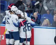  ?? CP PHOTO / LIAM RICHARDS ?? The United States celebrate a goal against Canada during third period of 2018 Four Nations Cup preliminar­y game in Saskatoon on Wednesday. The United States defeated Canada 2-1.