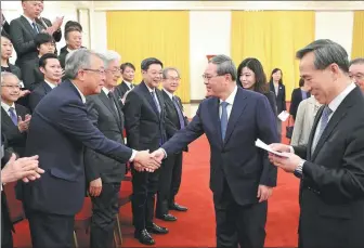  ?? FENG YONGBIN / CHINA DAILY ?? Premier Li Qiang meets on Thursday with a delegation of Japanese business leaders in Beijing.