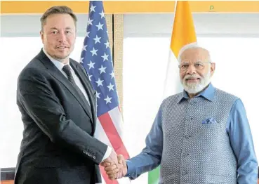  ?? /Press Informatio­n Bureau/Reuters ?? Going places: India's Prime Minister Narendra Modi shakes hands with Tesla chief executive Elon Musk during a meeting in New York last June.