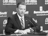  ?? BRUCE NEWMAN/ASSOCIATED PRESS ?? Ole Miss AD Ross Bjork, shown speaking to reporters in July, declined comment after Monday’s NCAA meetings.