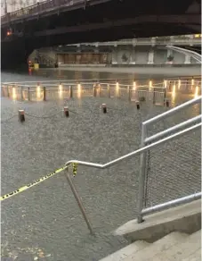  ?? SUN- TIMES ?? Heavy rains flooded the Chicago Riverwalk on Saturday. | JOHN O’NEILL/